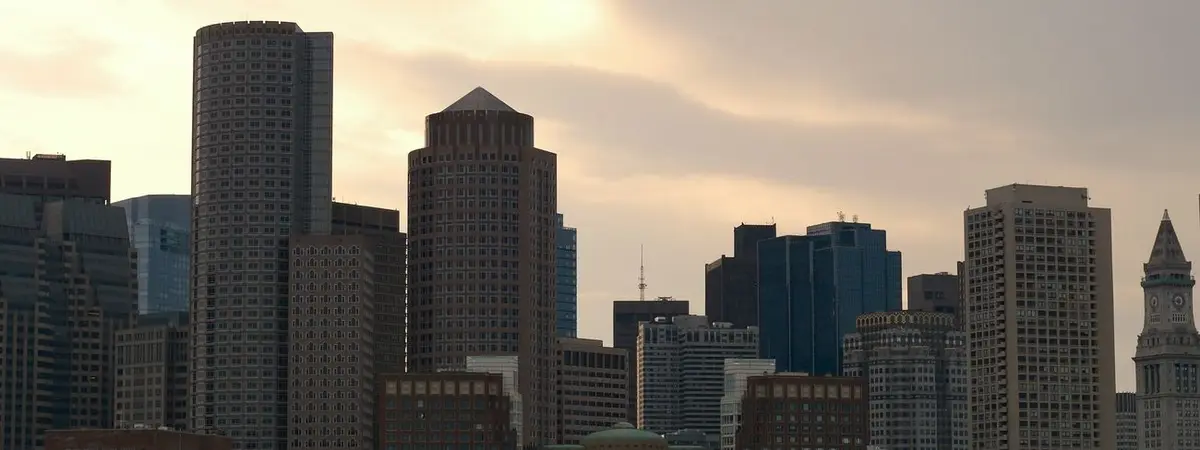 The Boston, Massachusetts skyline and harbor at dusk