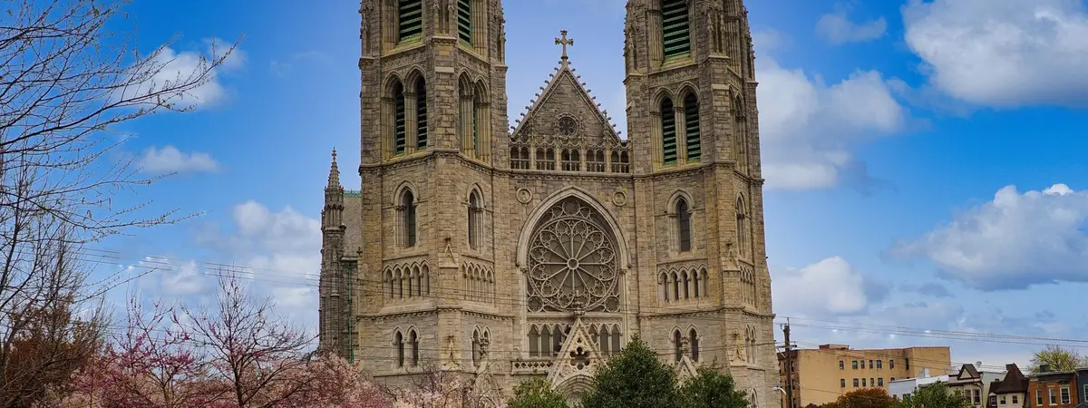 The Cathedral Basilica of the Sacred Heart in Newark, New Jersey, framed by blossoming trees